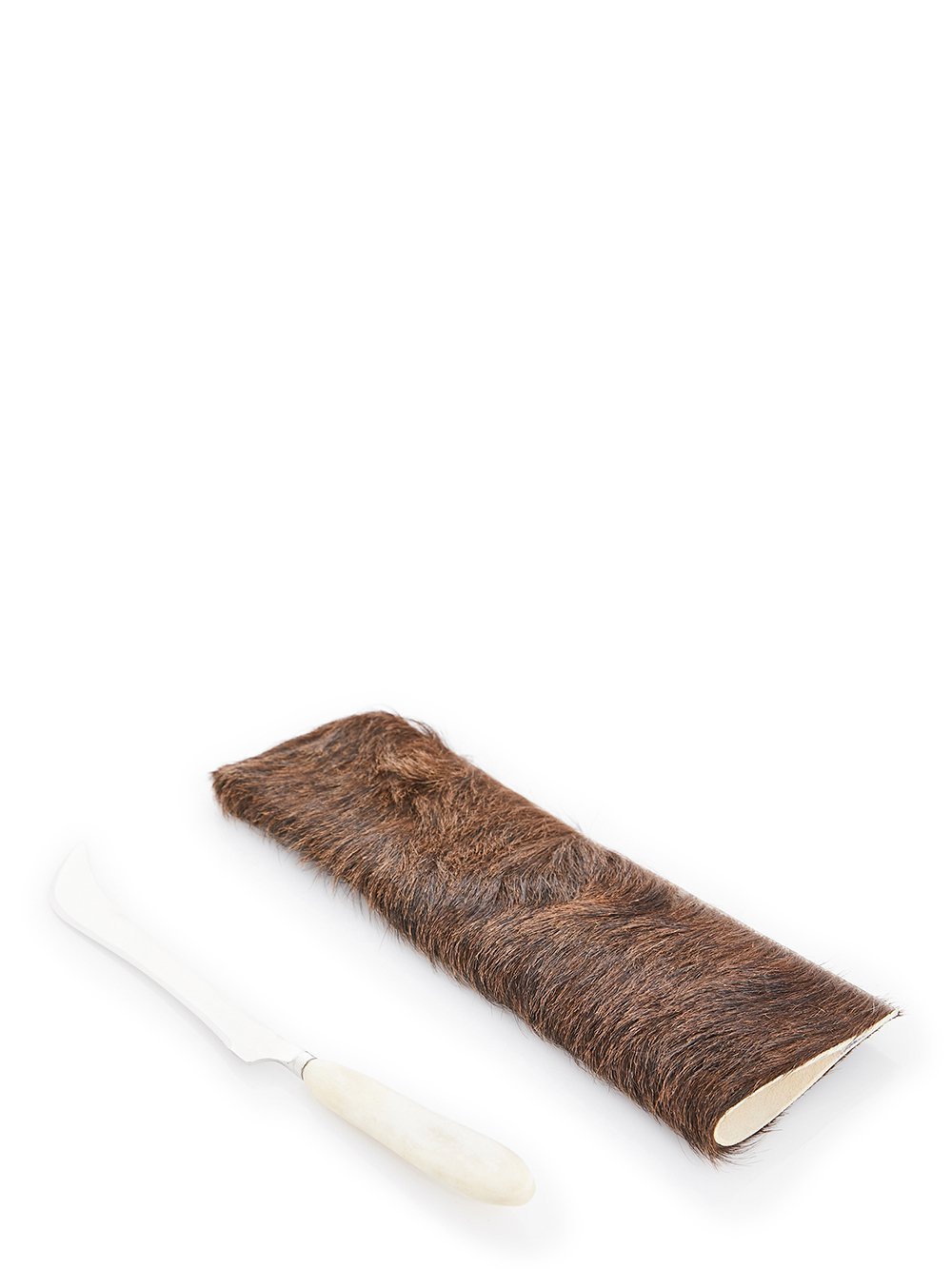 RICK OWENS CARVING KNIFE FEATURES A LONG AND SHARP STERLING TOP AND A SHORT, NATURAL COLOR BONE HANDLE.